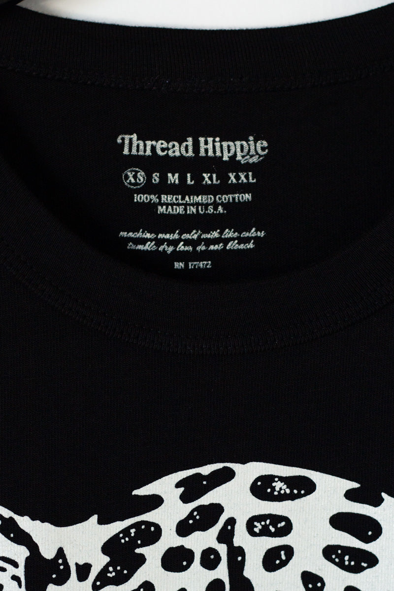 the "snow leopard II" graphic tee on black