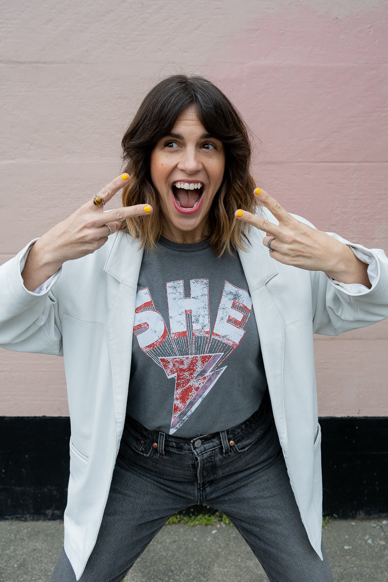 Thread Hippie She Energy women's graphic tee styled with white blazer.