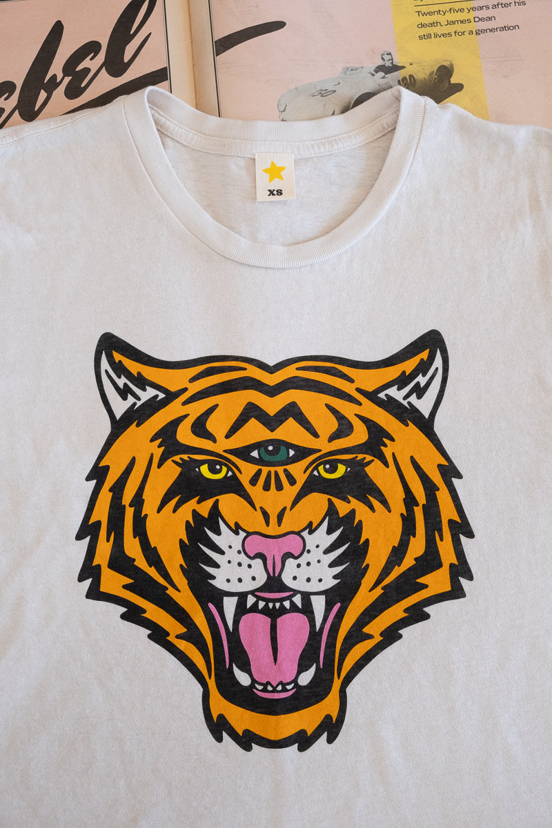 Vintage wash boxy tee in white on vintage Rolling Stone paper.