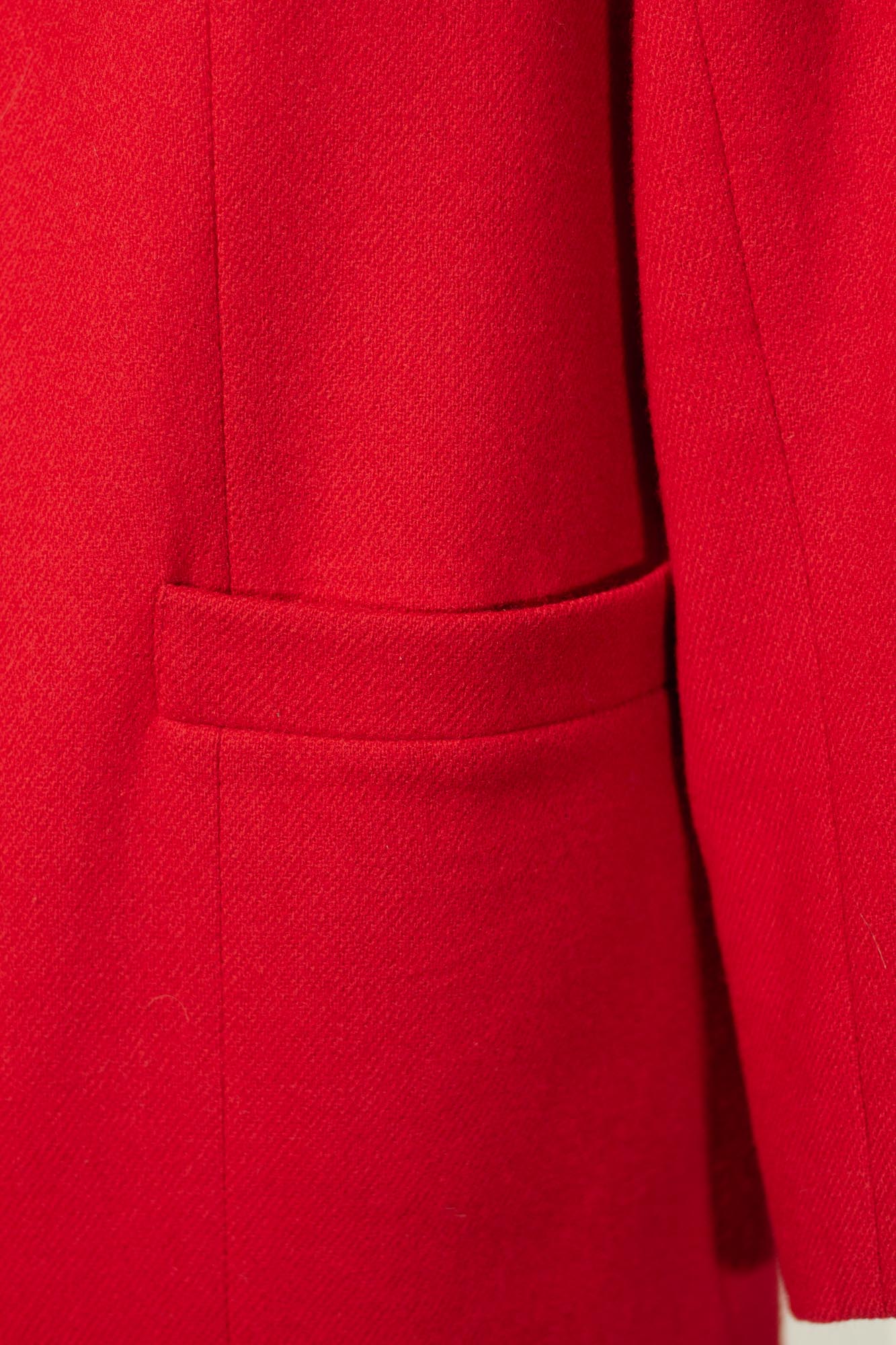 Close-up of a red coat with a pocket