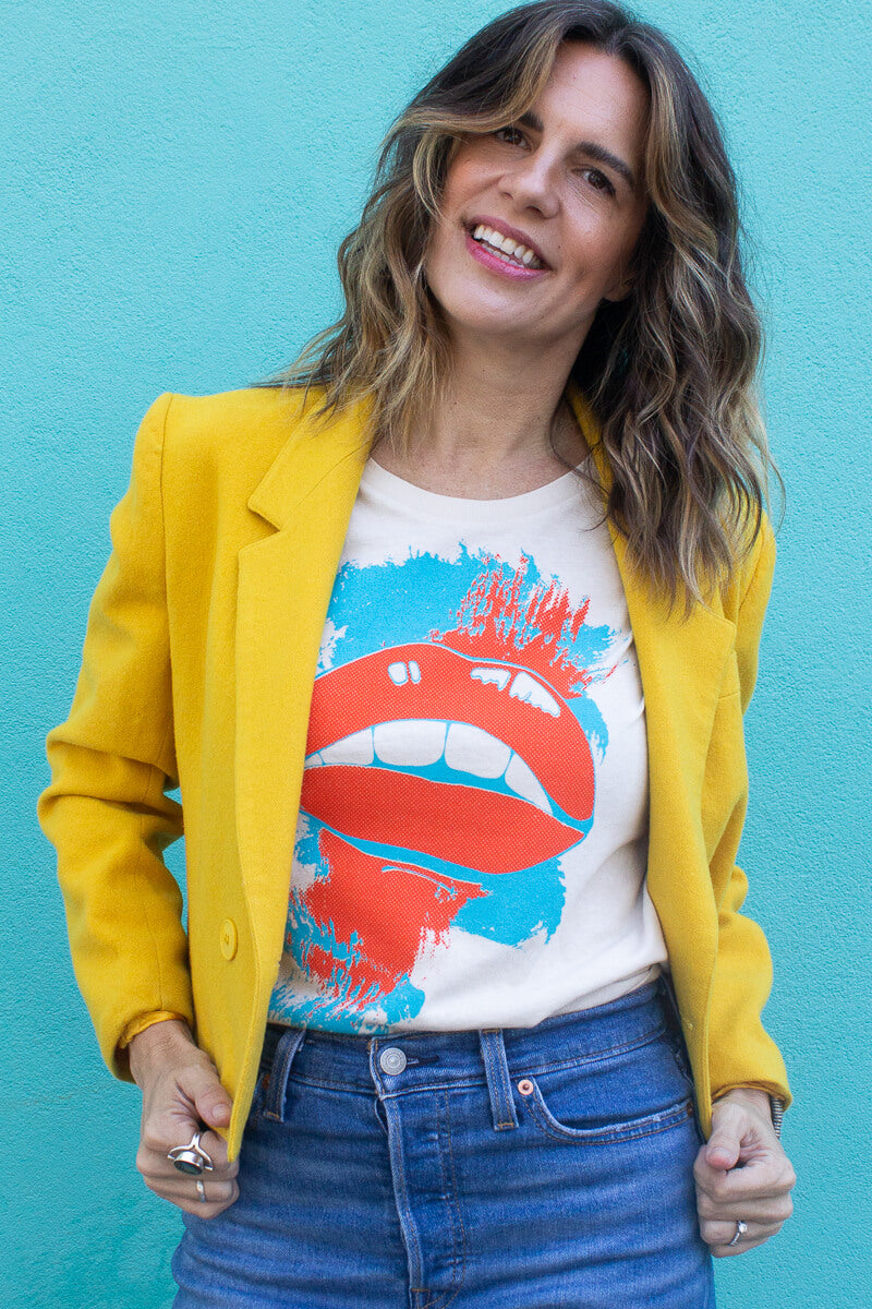 Woman modeling Thread Hippie she says tee styled with vintage yellow jacket.