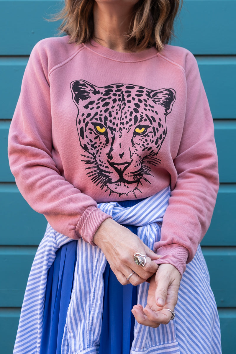 Thread Hippie pink snow leopard sweatshirt styled with button down shirt.
