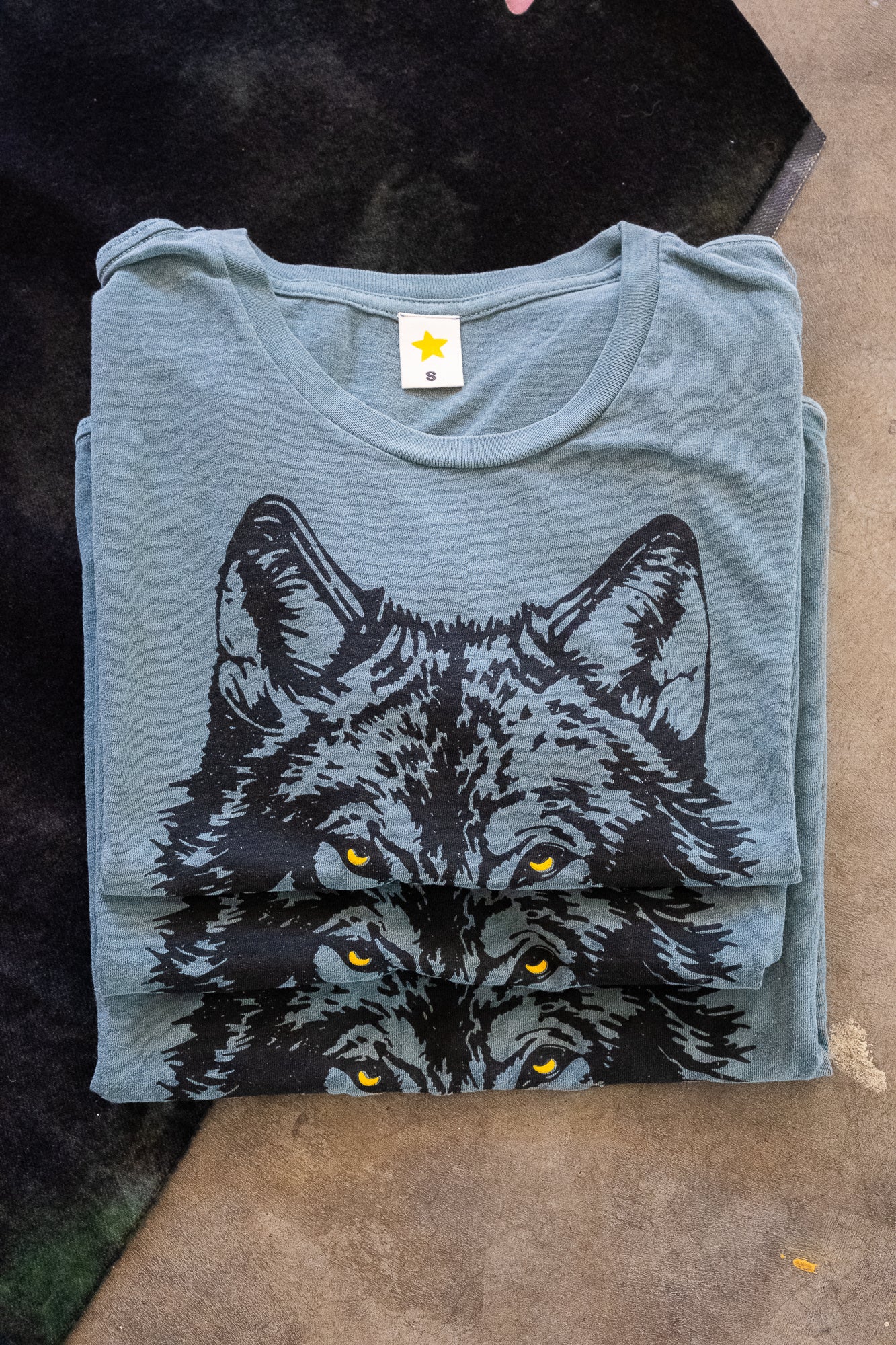 the "mother wolf" boxy tee on vintage green