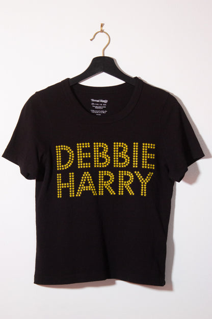 the "she's an icon" graphic tee on black