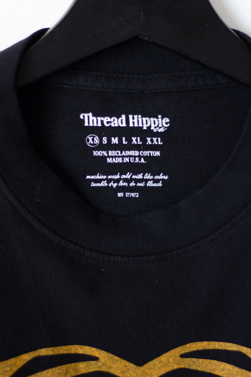 the "cosmic tiger II" graphic tee on black