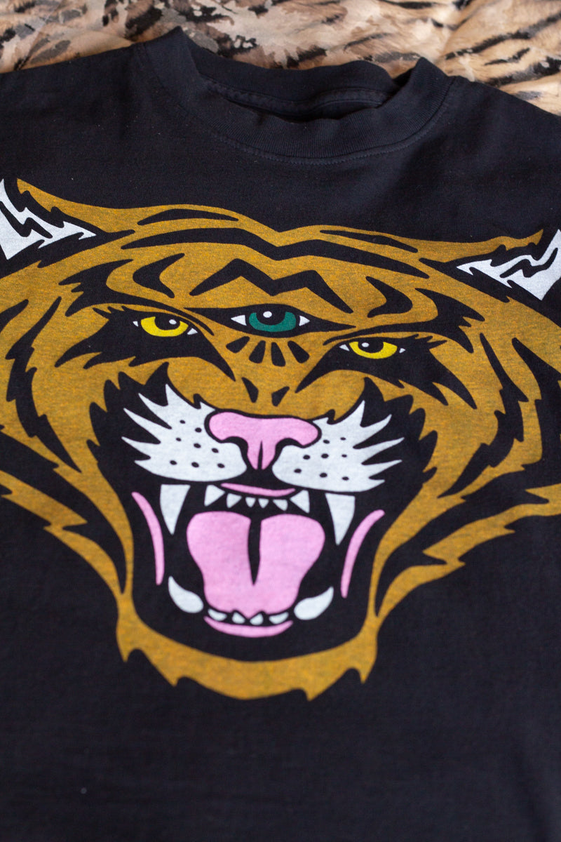 the "cosmic tiger II" graphic tee on black