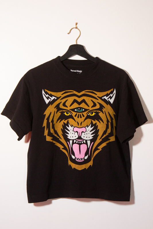 the "cosmic tiger II" graphic tee on black