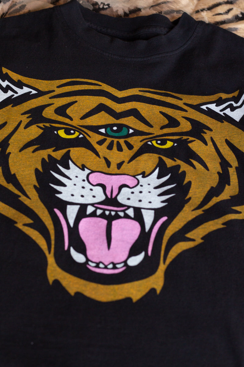 the "cosmic tiger II" graphic tee on black