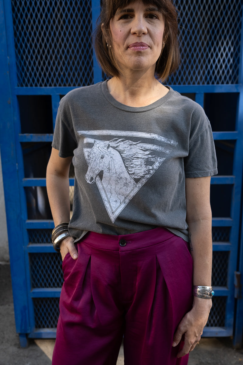 Women's 80s Horse boxy graphic tee on fashion model.