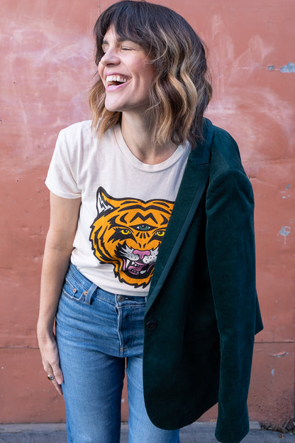 Women's Cosmic Tiger white boxy graphic tee styled with green velvet jacket.