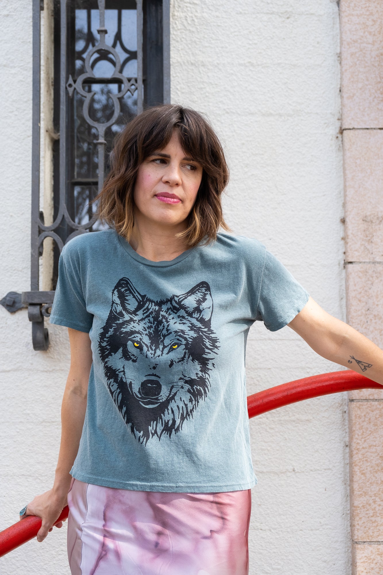 Women's Mother Wolf green boxy graphic tee in fashion photo.