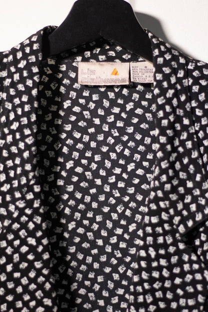 Black shirt with white pattern on a hanger