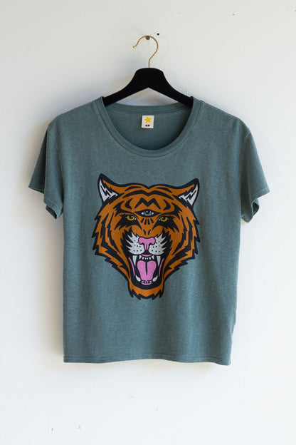 green women's t-shirt with a tiger graphic on a hanger against a white background.