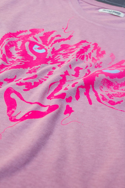 Detail photo of 1980s inspired tiger eyes tshirt.