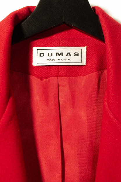 Red garment with 'Dumas' label on a hanger