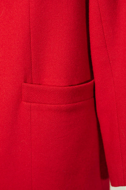 Close-up of a red coat with a pocket
