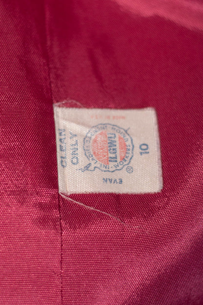 Close-up of a clothing label on a red fabric background