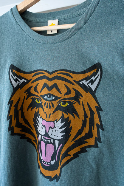 Green tiger graphic tee with third eye hanging.