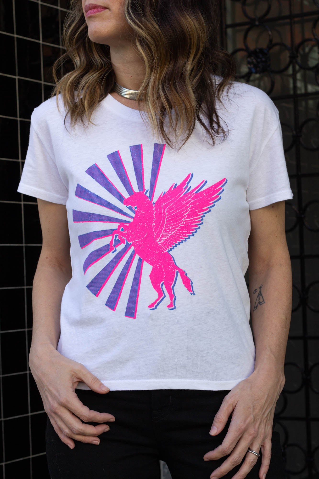 the "magic horse" graphic tee on white