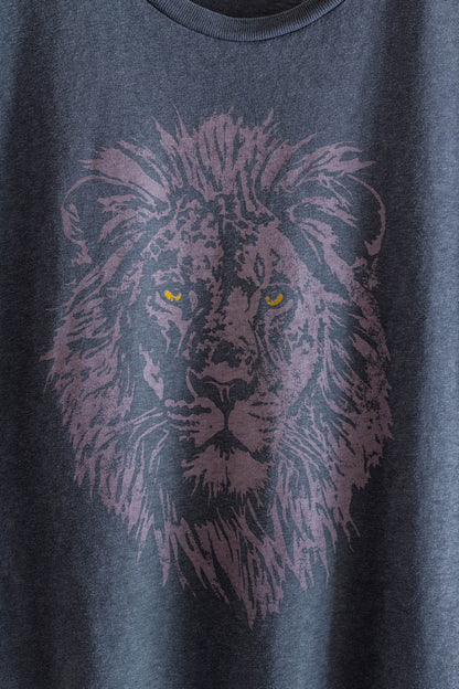 Black t-shirt with a purple lion graphic.