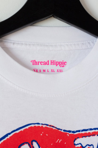 the "she says II" graphic tee on white