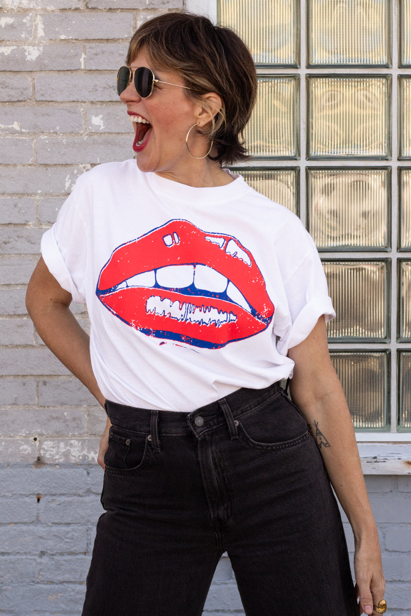 the "she says II" graphic tee on white