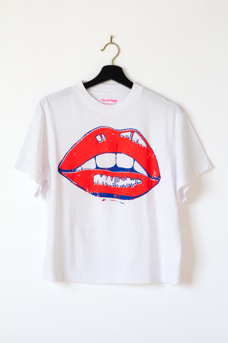 the "she says II" graphic tee on white
