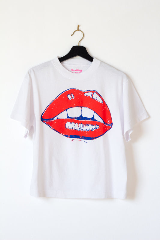 the "she says II" graphic tee on white