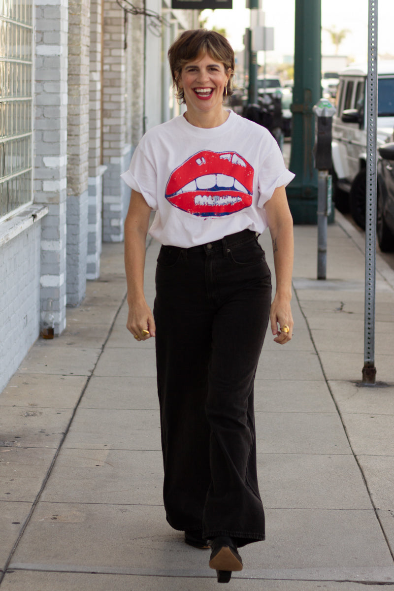 the "she says II" graphic tee on white