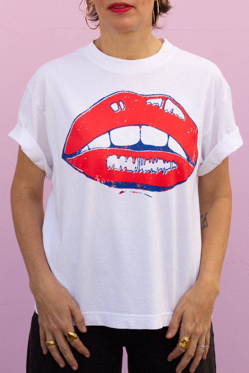 the "she says II" graphic tee on white