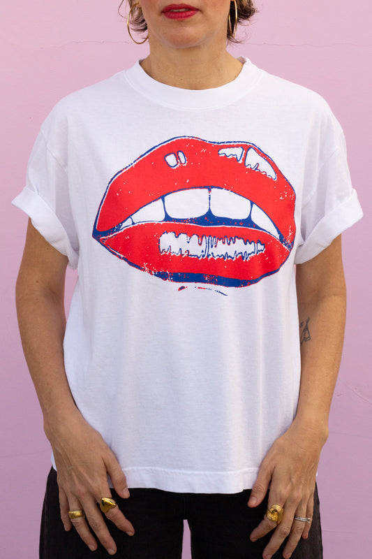the "she says II" graphic tee on white