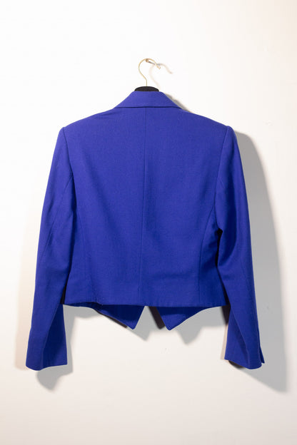 Blue blazer on a hanger against a white background