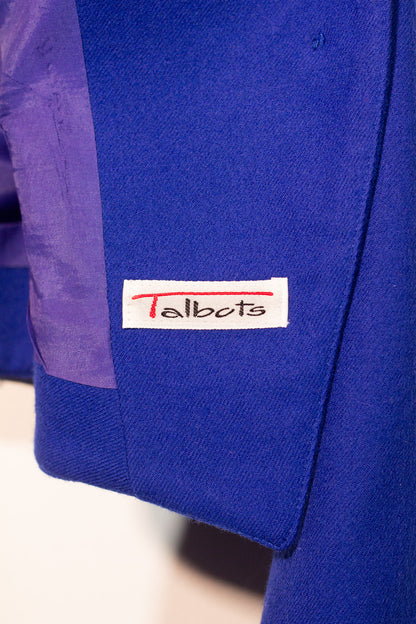 Blue jacket with a Talbots label on a white background