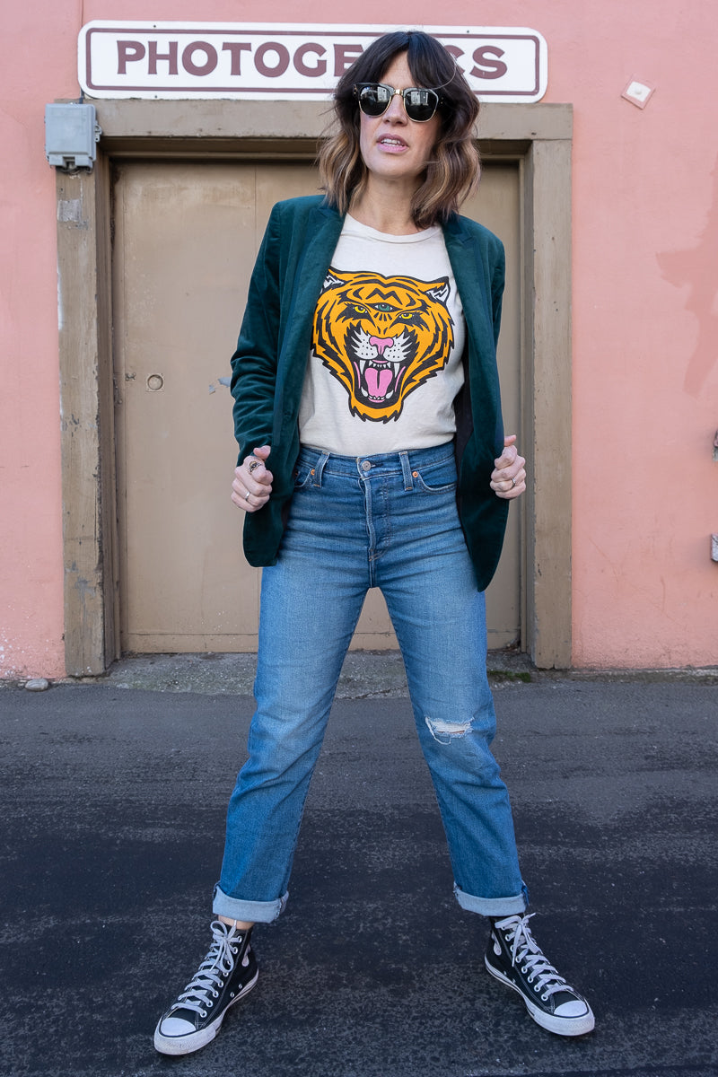 Cosmic Tiger white boxy tee styled with Chucks, Levis, and Raybans.