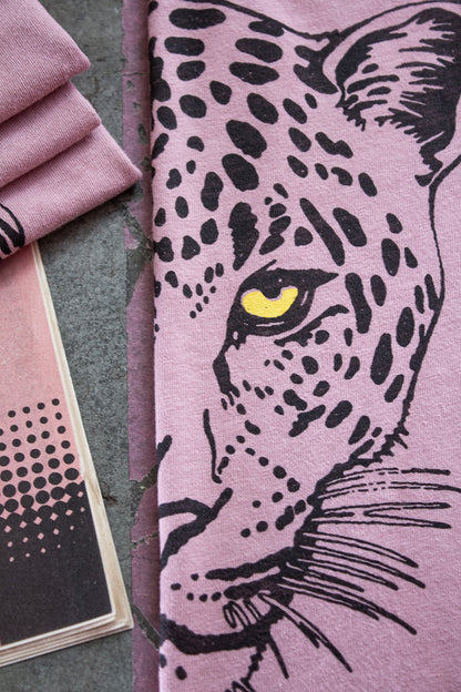 Detailed shot of Thread Hippie pink leopard graphic tee.