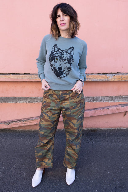 Thread Hippie women's green sweatshirt styled with camo pants.