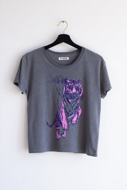 Gray t-shirt with a purple tiger design on a hanger against a white background.