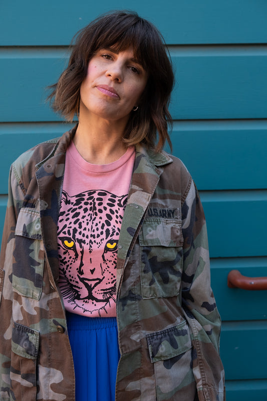 Women's Leopard pink boxy graphic tee styled with camo jacket.