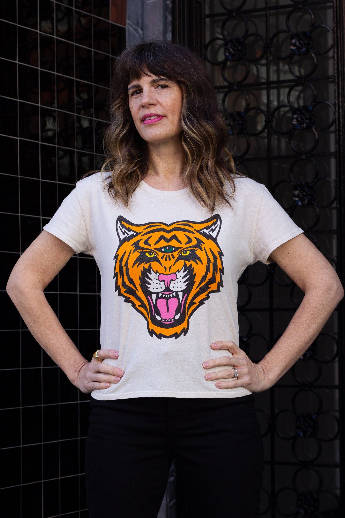 Woman wearing white graphic tee with third eye tiger in San Francisco.