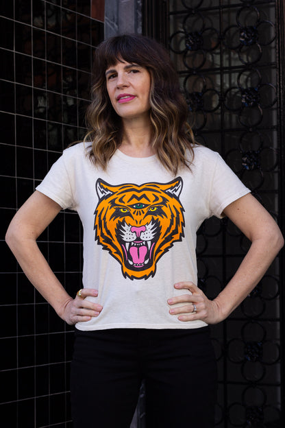 Woman wearing white graphic tee with third eye tiger in San Francisco.