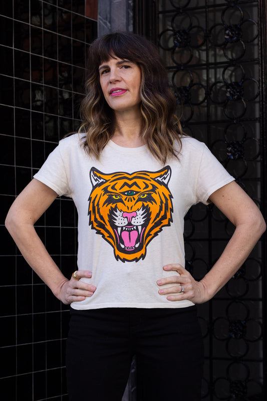 Woman wearing white graphic tee with third eye tiger in San Francisco.