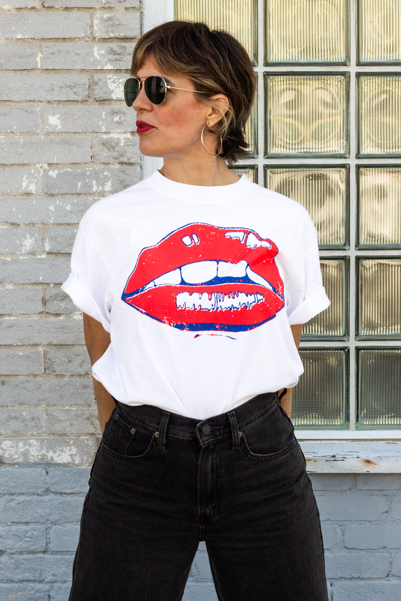 the "she says II" graphic tee on white