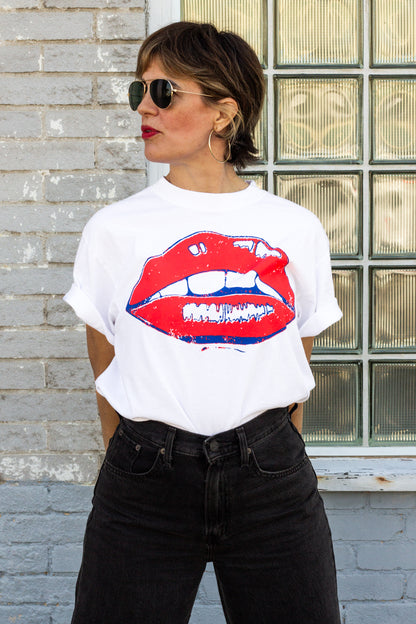 the "she says II" graphic tee on white