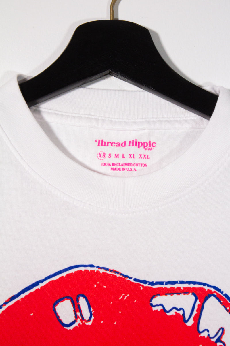 the "she says II" graphic tee on white