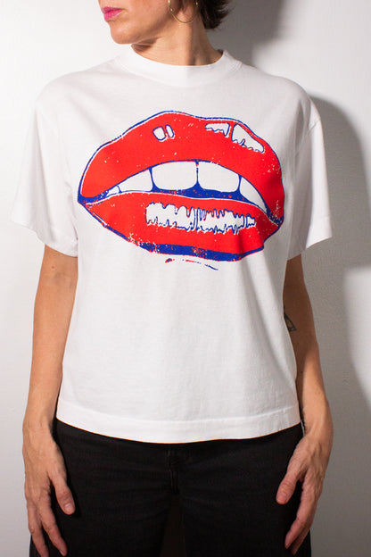 the "she says II" graphic tee on white