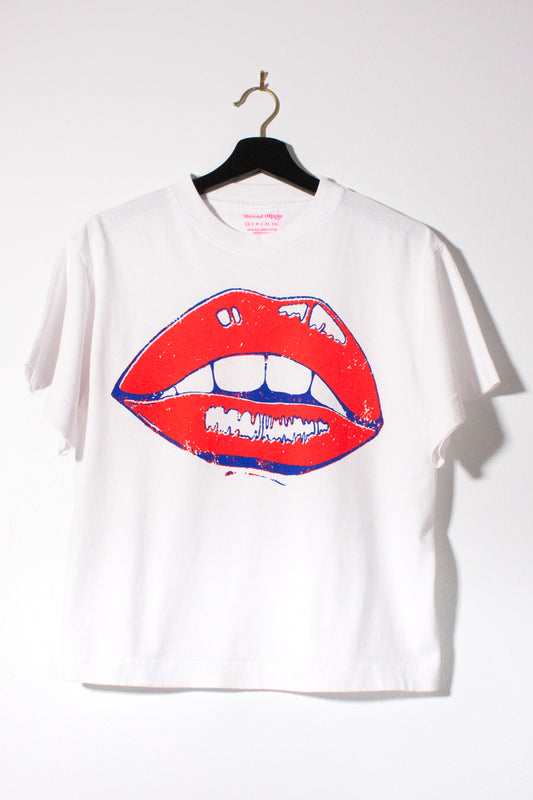 the "she says II" graphic tee on white