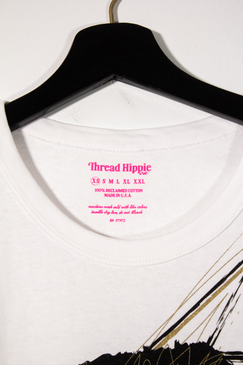 the "she's electric" graphic tee on white