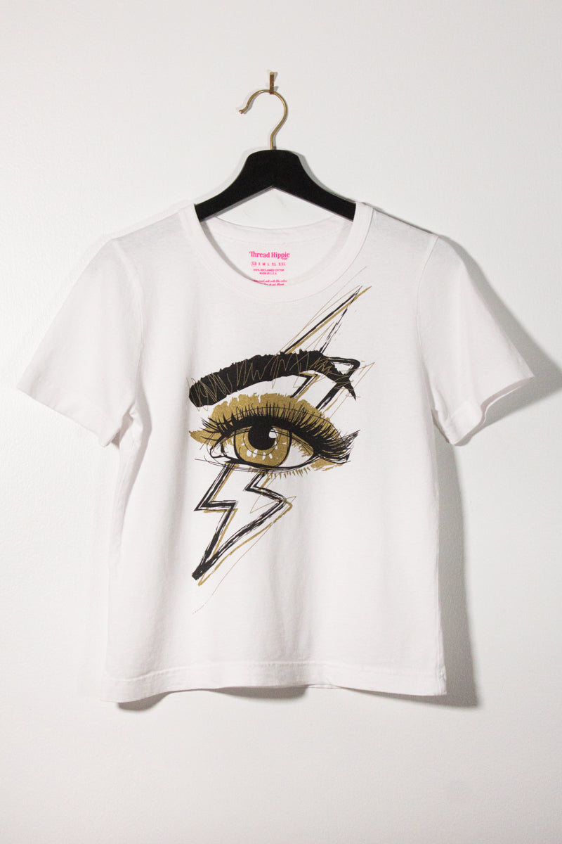 the "she's electric" graphic tee on white