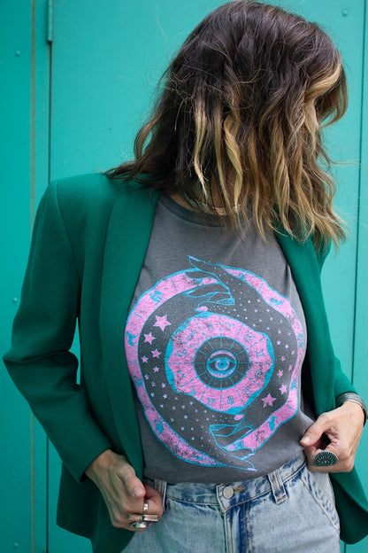 Zodiac women’s designer graphic tee in vintage black styled casually with denim and vintage green blazer.